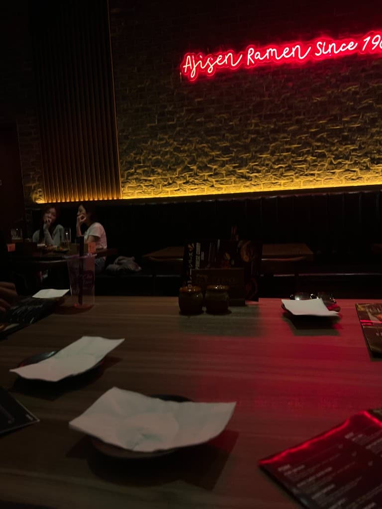 Ajisen Ramen neon sign over the table