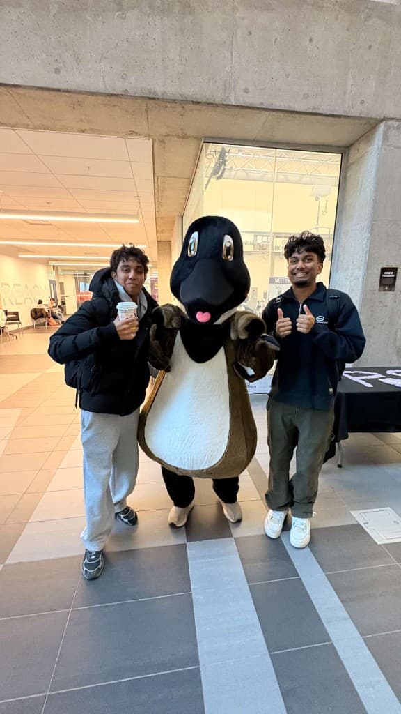 Posing with the Waterloo goose mascot