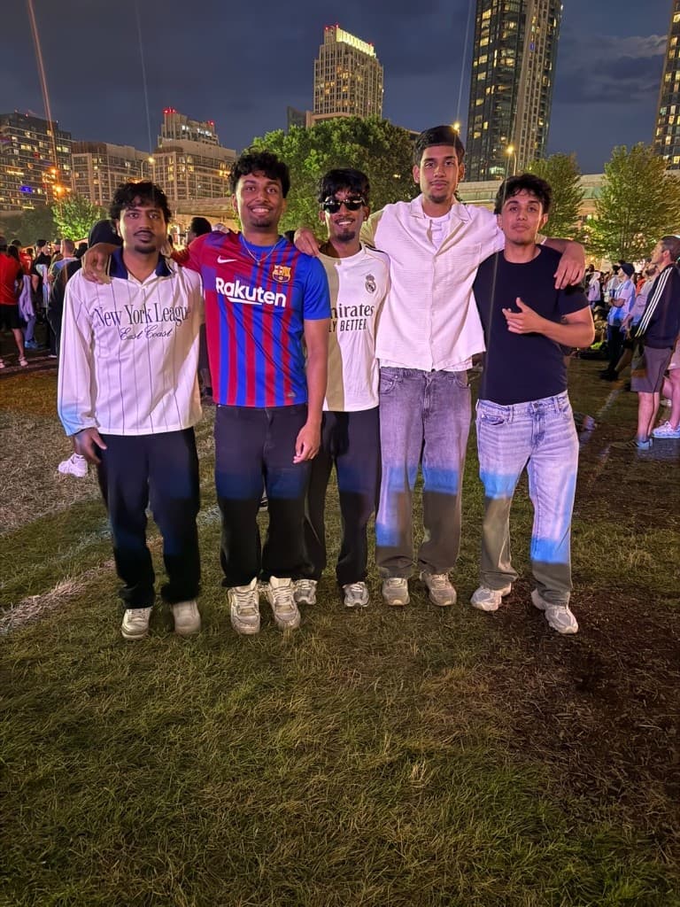 Friends in soccer jerseys by the city skyline